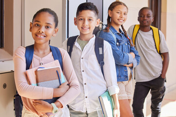 Canvas Print - Children, education and school with books and learning portrait, waiting for class and happy to learn. Youth, students and diversity with friendship and kids at academy or primary school.