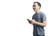 © Ibenk.88 - Young smiling handsome Asian man in casual attire using mobile phone isolated studio background