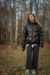 © shymar27 - Portrait of a young beautiful woman in a dark autumn jacket.