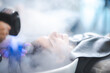© chokniti - Young woman pampering herself at salon with hair spa, hair cut and hair wash with steam in salon