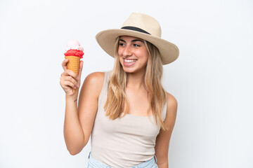 Wall Mural - Young caucasian woman with a cornet ice cream isolated on white background with happy expression