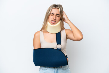 Wall Mural - Woman with broken arm and wearing a sling isolated on white background with headache