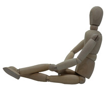 Wooden Jointed Figure Sitting On Ground With Legs Crossed And Hands In Lap
