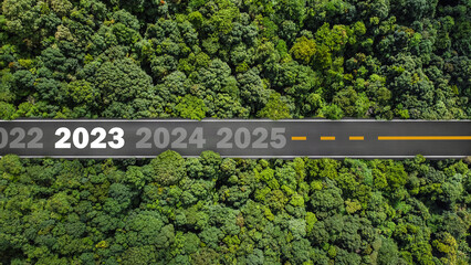 new year 2023 numbers on road drag tires Planning concept, goals, challenges, environment in 2023, bird's eye view.