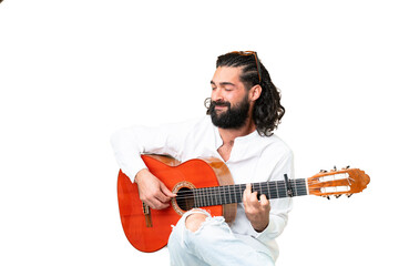 Wall Mural - Young man with beard with guitar over isolated chroma key background