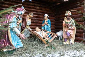 Nativity of Christ. Christmas Nativity scene with The Holy Child, The Blessed Virgin Mary, Saint Joseph, the Magi, and sheep.