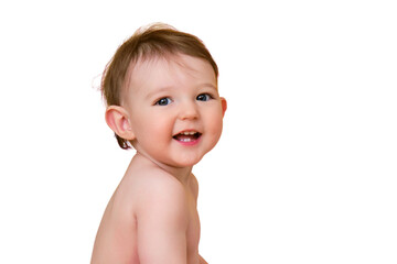 Happy baby toddler boy is sitting in a bathtub, isolated on white background. A smiling child at the age of one year