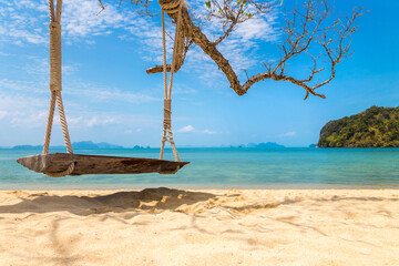 Wall Mural - Empty swing at tropical beach