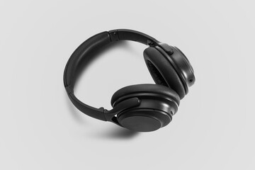 Poster - Computer headphones. Black headphones on a white background. The concept of listening to music, creating audio, music. Computer work, abstraction and minimalist style.