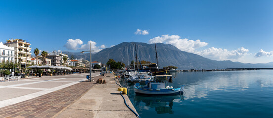 Sticker - panorama view of the waterfront and harbor in Kalamata with many boats moored on the harbor wall