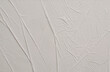 © Liliia - Empty crumpled wet craft paper blank texture copy space wall background. Gray beige pastel color.