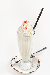 Poster - Milkshake with whipped cream on white background