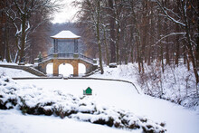 Winter View Of The Snow-covered Chinese Bridge And Lake In Oleksandria Park, Ukraine