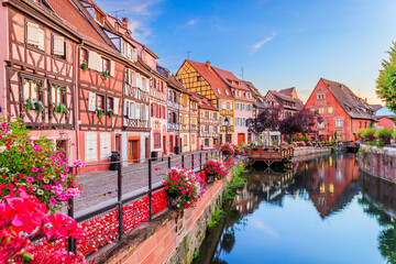 Colmar, Alsace. France. Petite Venice, water canal and traditional half timbered houses.