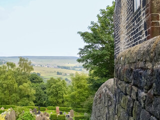 Sticker - English landscape view over graveyard beside stone building