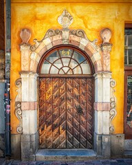 Sticker - Vertical image of a beautiful ornate wooden door found in the Gamla stan area of Stockholm