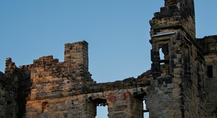 Closeup of Ashby de la Zouch Castle ruins with a blue sky in the background