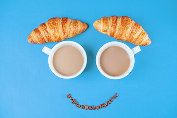 Wall Mural - Cups of fresh hot coffee on a blue background