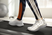 Digital Composite Of Highlighted Bones And Woman Training On Walking Treadmill Indoors, Closeup