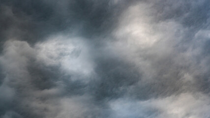 Texture of bright blue dramatic cloudy sky.