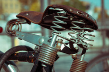 Brown Leather Vintage Bicycle Saddle. Old Leather Cushion Metal Squeaky Springs.
