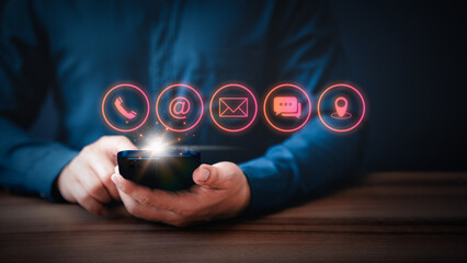Poster - Businessman using mobile phone or smartphone with the call phone, email, address, chat message and map icons. Customer support hotline contact us people connection concept.