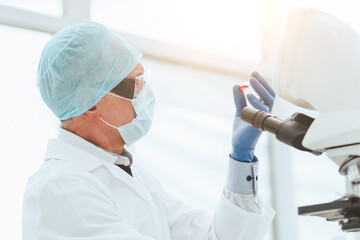 Wall Mural - close up. scientist in testing a new drug in the lab .