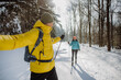 © Halfpoint - Senior couple skiing together in the middle of forest.