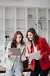 © Nuttapong punna - Two businesswoman discuss investment project working and planning strategy with tablet laptop computer in office.
