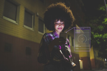 Young woman using mobile phone to control smart home at night