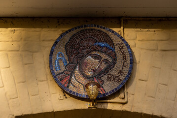 Wall Mural - Mosaic of the Archangel Michael on the entrance gate with a lamp