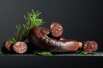 Wall Mural - Spanish black pudding or blood sausage with rosemary.