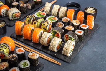 Wall Mural - Sushi set on dark slate background