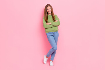 Poster - Full length photo of cheerful confident schoolgirl wear green sweatshirt arms crossed isolated pink color background