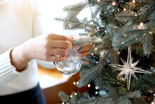 Woman Decorating The Christmas Tree