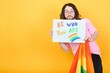 © Serhii - Attractive gay caucasian man holding a protest sign during a LGBT pride parade. Equality.