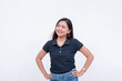 © Mdv Edwards - A pretty young Filipina intern in a dark blue polo shirt and jeans looking to the left. Isolated on a white background.