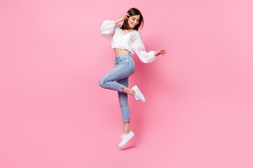 Wall Mural - Full length photo of cute lady skinny figure look empty space footwear satisfied trendy purchase outfit isolated on pink color background