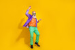 © deagreez - Full length photo of nice grandparent dancing boogie woogie enjoy festive dressed stylish colorful look isolated on yellow color background