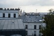 Rooftops of the buildings in Montmartre with TV antennas, skylights and a group of chimneys in Paris