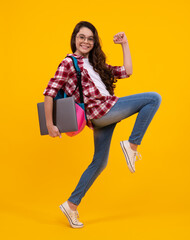 Poster - Young girl student, studying hold computer. E-learning concept. Funny pupil with laptop. Back to school. Run and jump, jumping kid.