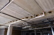 © Tad - plumbing below a concrete deck