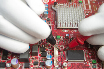 Poster - mechanic repairing motherboard, motherboard top view close-up, computer motherboard