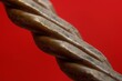 Closeup of copper wire texture on red background