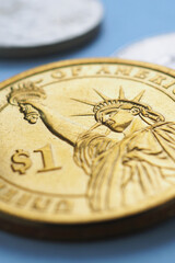 Wall Mural - american money lies on blue surface. 1 dollar coin closeup. statue of liberty. sign of national curr