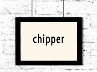 Wall Mural - Black frame hanging on white brick wall with inscription chipper