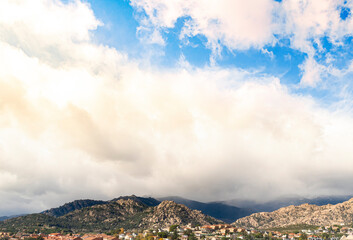 landscape with clouds over the mountains when a coming storm