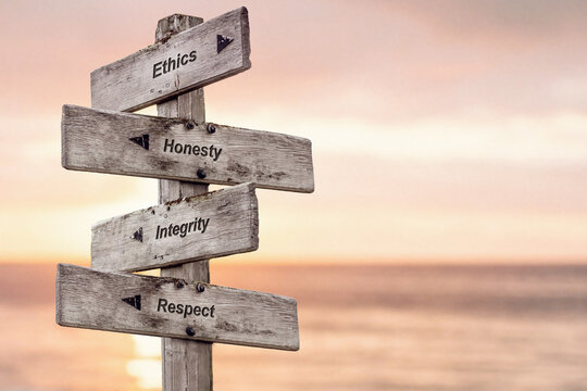 Wall Mural - ethics honesty integrity respect text written on wooden signpost outdoors at the beach during sunset