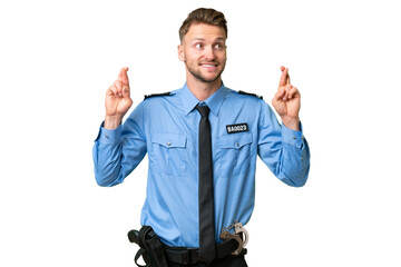 Wall Mural - Young police man over isolated background with fingers crossing