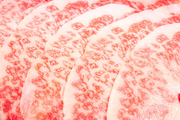 Wall Mural - Close up shot Rare Sliced Wagyu beef with marbled texture, Marbled meat texture of Beef Marbling.